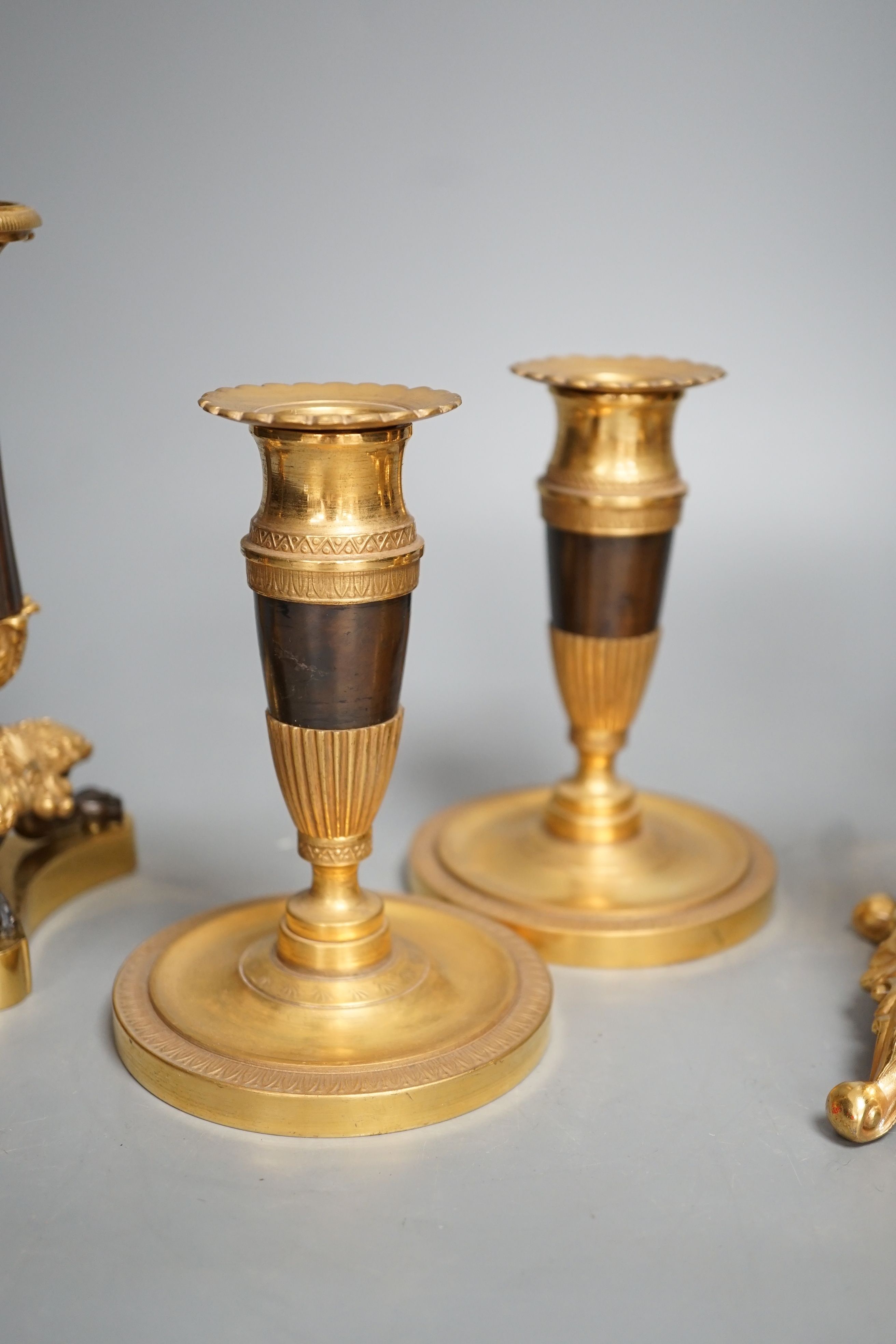 Three pairs of gilt metal candlesticks, tallest 16cm